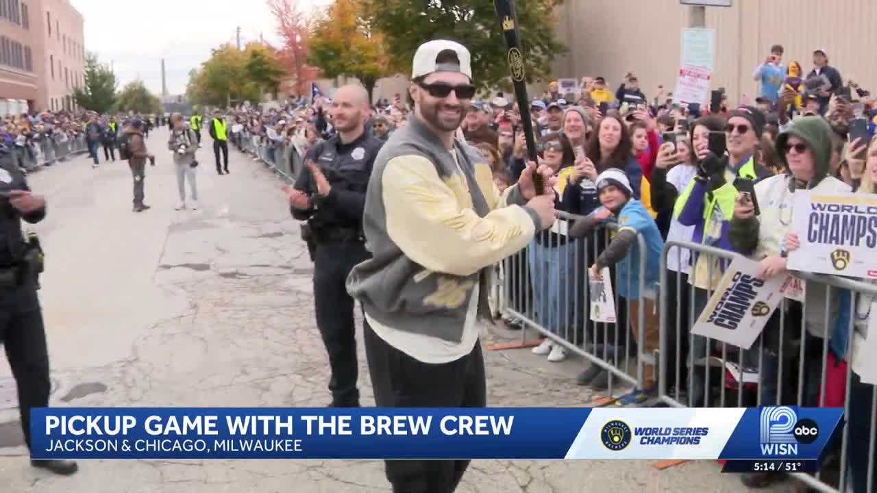 Garrett Mitchell interacts with fans during the Brewers' Championship Parade in Brookfield.